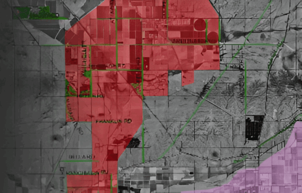 Map showing red-highlighted zones and surrounding areas with roads and landmarks.