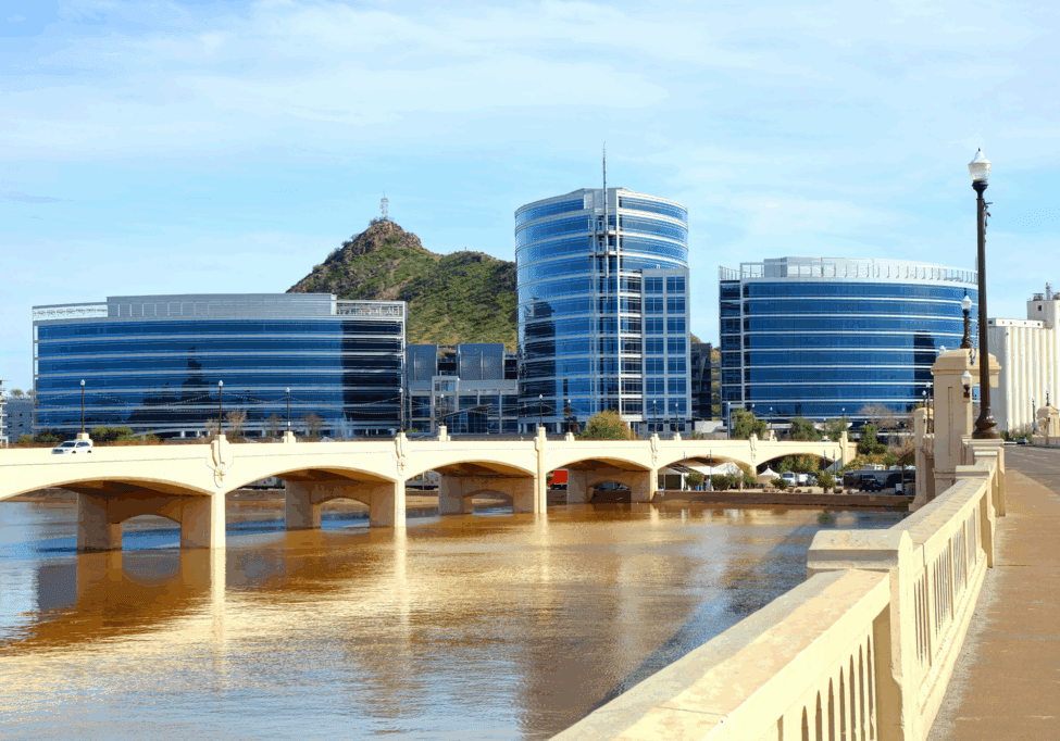 Modern buildings and bridge over a river.